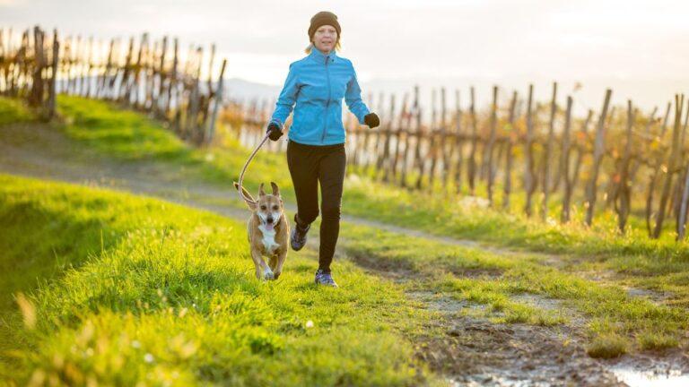 Senior female running with her dog