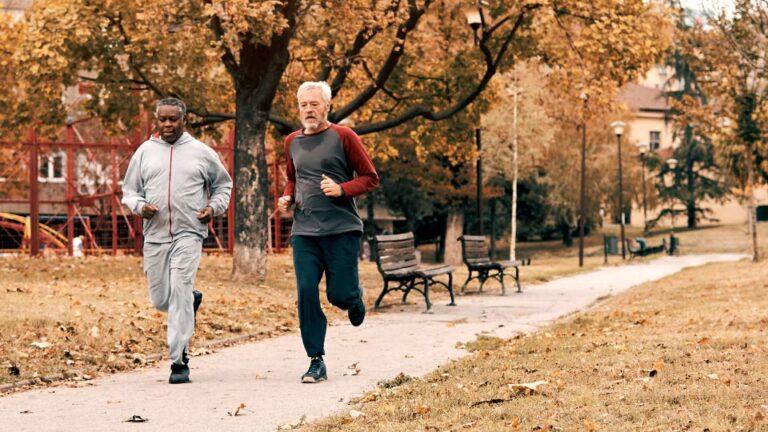 Two senior males running together